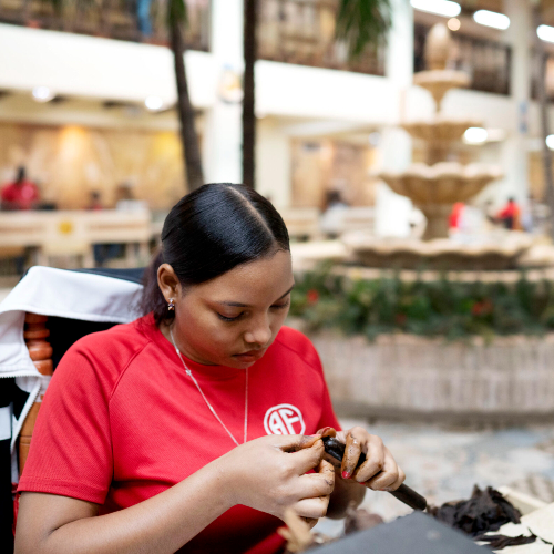 The Story of Cigars NH Cigars women cigar roller fuente